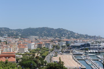 Fototapeta na wymiar Panorama of Cannes harbour with yachts at Mediterranean Sea in summer on a sunny day