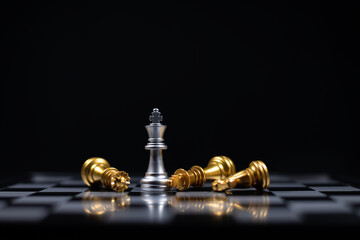 Chess board game between silver team and golden team is stategy game as business challange competitive game ,this business stategy plan concept.