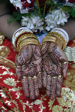 The hand of bride in Bengali marriage ceremony, where she shows her painted hands by "mehendi", a colour made of dried leaves.