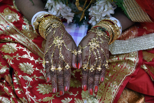 The hand of bride in Bengali marriage ceremony, where she shows her painted hands by "mehendi", a colour made of dried leaves.