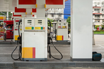 Pumping gasoline fuel in car at gas station.concept Travel,price oil,industrail business and...