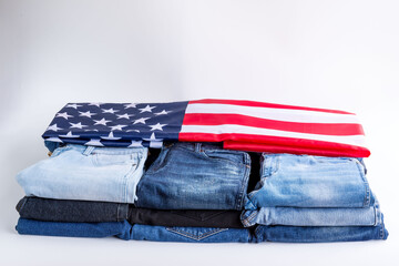 Jeans stack on a white background in store and supermarke and flag USA .t.concept fashion dress jeans..