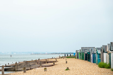 Fototapeta premium beach huts on the seashore in England