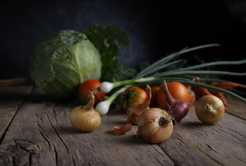 autumn harvest of garden crops on a vintage wooden table