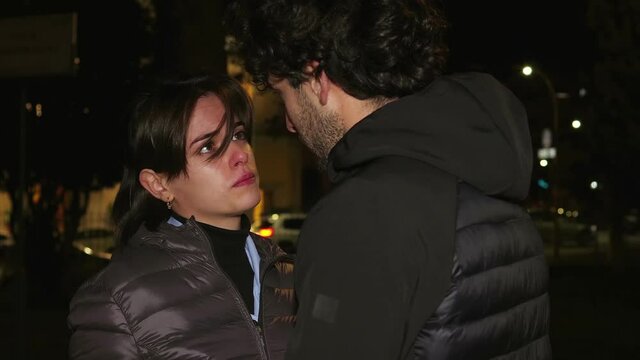 end of a love - girl rejects boyfriend who tries to be forgiven - night scene