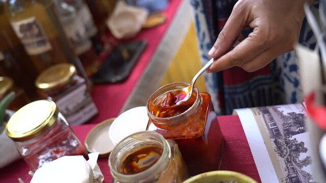 An Indian fair market and pickles in glass jars