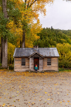 Travel lifestyle view of an abandoned wooden cabin in Arrowtown, historic gold mining town in the Otago region of the South Island of New Zealand.