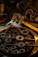 caliper garage old tool on the workbench stand wheel wrenches screwdriver