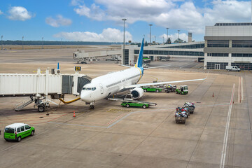 Preparing a passenger plane for loading luggage before departure
