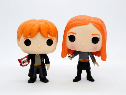 Ginny and Ron Weasley Funko pop. Brother and sister. Characters from the Harry Potter books and movies. J. K. Rowling. Toys. Collectible. Isolated white.