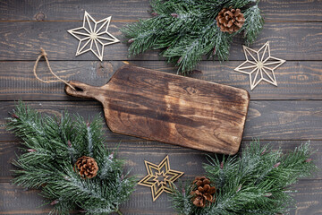 Empty cutting board on a old christmas rustik table.