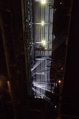 Aksu, Kazakhstan - May 29, 2012: Profile roof and sun rays in steamed air. Interior of electric power plant.