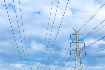 Fototapeta premium Height voltage tower line on the cloudy sky background.