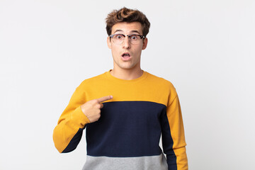  looking shocked and surprised with mouth wide open, pointing to self