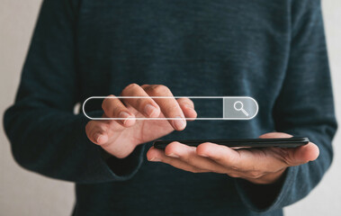 Close up hands holding smartphone. man working with smart phone and with blank search bar. Searching Browsing Internet Data Information Networking Concept