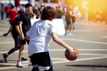 The guy with the basketball is preparing to attack.