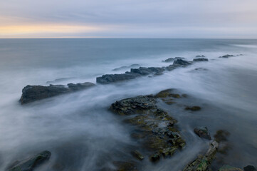Ocean or Sea Water Washing Up Onto Rocky Shore