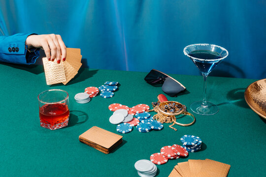Crop anonymous woman playing poker