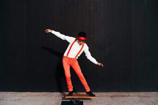 Circus performer on balance board