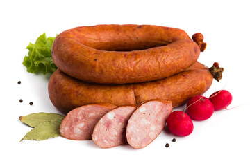 baked smoked sausage with lard on a white plate