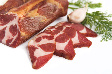 baked smoked piece of meat on a white plate