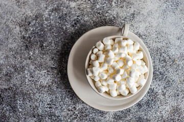 Overhead view of a mug filled with mini marshmallows