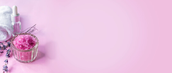 Lavender salt with natural spa products and bath decor close-up. copy space