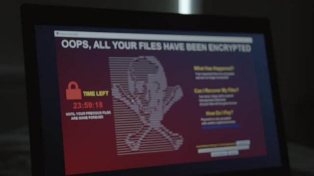 Ransomware running on PC Screen in Closeup all files are encrypted by blackmailing virus countdown until deletion