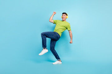 Fototapeta na wymiar Full length body size photo man in headphones gesturing like winner isolated pastel blue color background