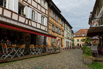 Fototapeta na wymiar STRASBOURG, FRANCE, June 23, 2021 : A touristic street in Petite France quarter, home in the Middle Ages to the city's tanners, and now a main tourist attraction.
