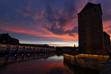 STRASBOURG, FRANCE, June 23, 2021 : Barrage Vauban at night. This bridge, weir and defensive work...