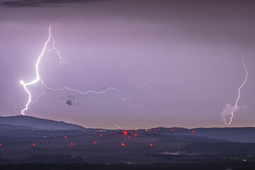 Naklejka na ściany i meble Lightning over Ore Mountains and windfarm Krystofovy Hamry (Rusova)