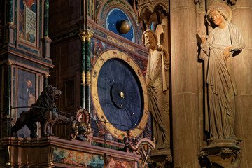 STRASBOURG, FRANCE, June 23, 2021 : Strasbourg Cathedral astronomical clock, located in the south transept, is one of the most famous features of the cathedral. - obrazy, fototapety, plakaty
