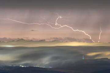 Lightning over Chemnitz chimney, With 302m highest building of Saxony, Germany.