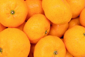 Mandarin oranges in stacks. Isolated on white.