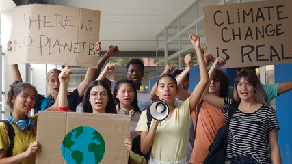 Group of multi-ethnic teenagers protesting against climate change. No planet b