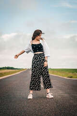 teenager girl dancing on the road. freedom generation z