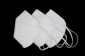 Disposable KN-95 masks or white colored new medical masks. COVID-19 prevention. H1N1, H5N1 safety...