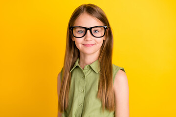 Photo portrait schoolgirl wearing green shirt glasses smiling isolated bright yellow color background