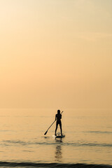 A female paddleboarder, Cornwall, UK.