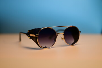 steampunk sunglasses with leather inserts on a dark background