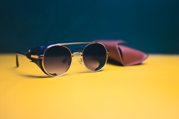 steampunk sunglasses with leather case on dark background