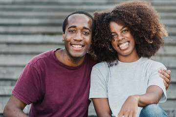 African friends having fun smiling on camera - Focus on man face
