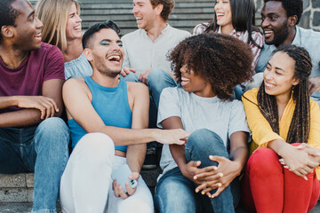 Multiracial people having fun outdoor in the city - Focus on center girl face