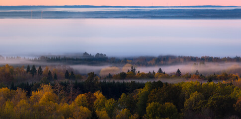 Obraz premium Foggy Autumn morning, view from a mountain in Sweden