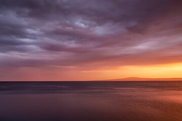 Sunrise over lake Vänern in Sweden during thunderstorm