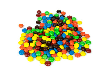 Colorful chocolate in and out of focus on white background.