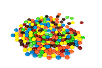 Colorful chocolate in and out of focus on white background.