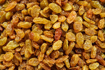 Raisins lie on the table. Food background.