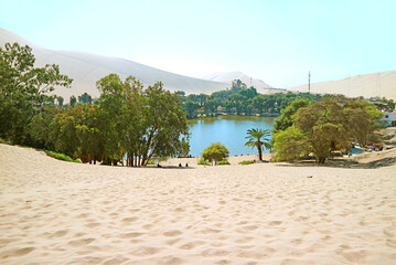 Beautiful oasis of Huacachina surrounded by sand dunes, Ica region, Peru